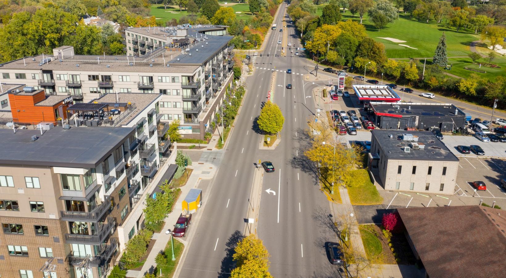 The essence of exceptional living a street with cars and buildings