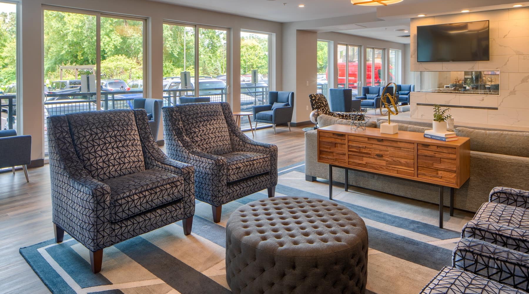 Elevate Your Life at Ellipse and E2 lounge area with modern decor and ample seating